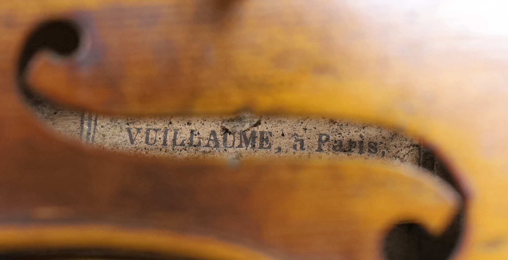 A Vuillaume violin with a bow, in case, back measures 36cm excl button